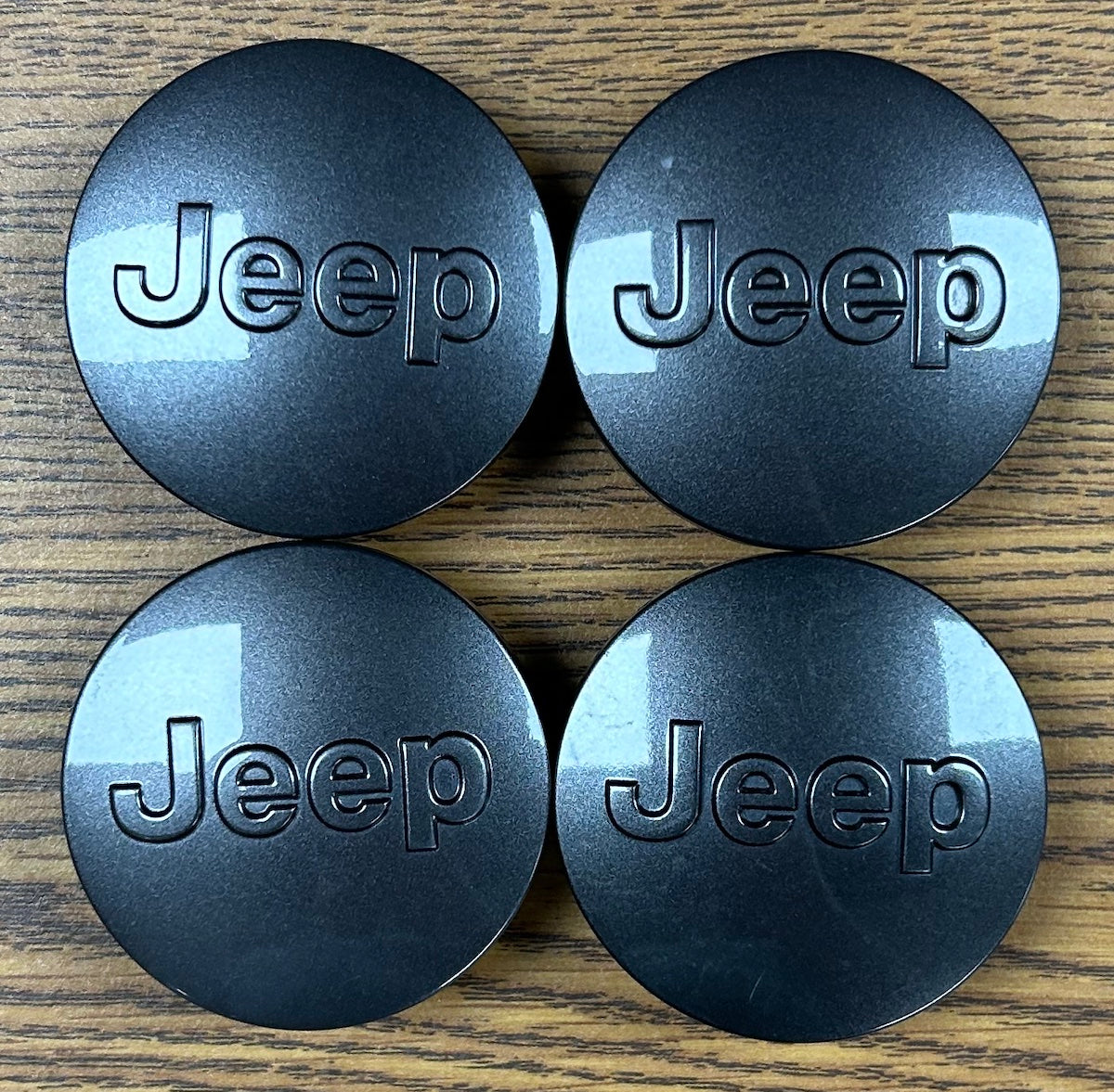 2 1/2" Jeep Cherokee, Grand Cherokee Dark Charcoal Center Cap 1LB77LSTAC set